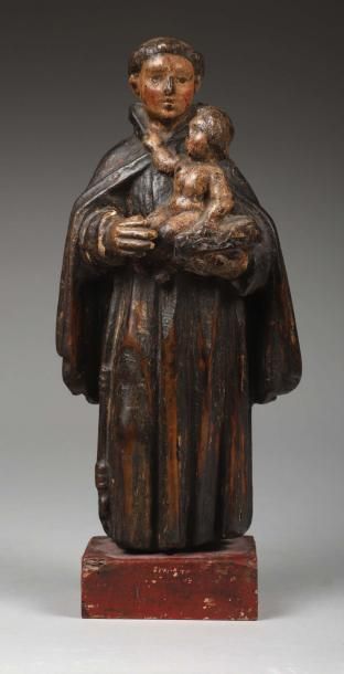 null Saint François d'Assise Bois sculpté polychrome.
Le Saint debout porte le Livre...