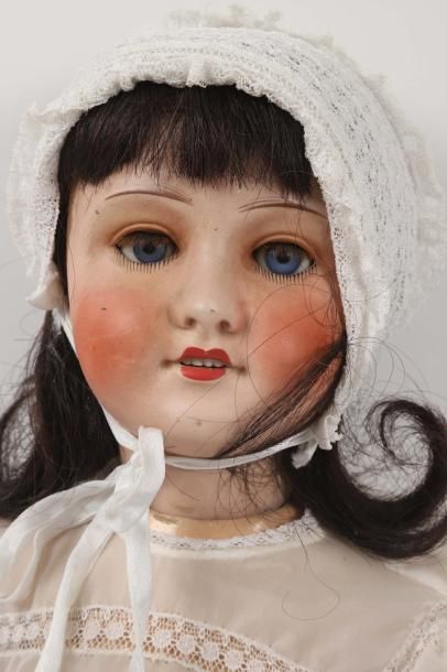 null Une poupée tête porcelaine marquée en creux: UNIS FRANCE 301, T.11, yeux mobiles...