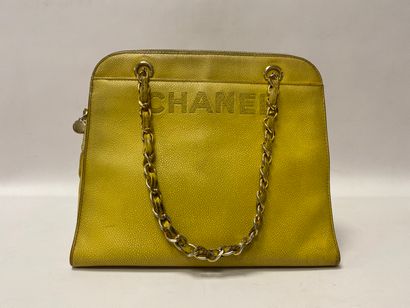 CHANEL. Yellow leather handbag (wear and...