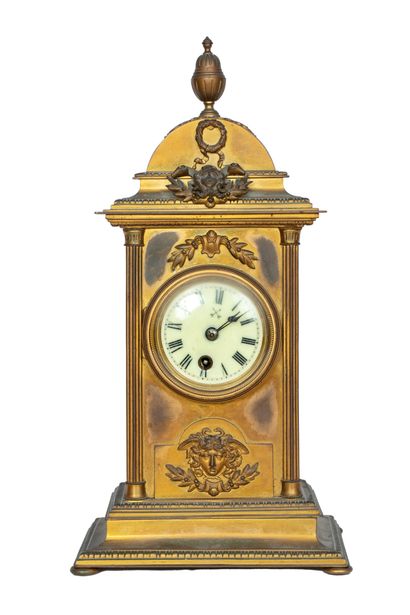 Rectangular gilt bronze clock topped by a...