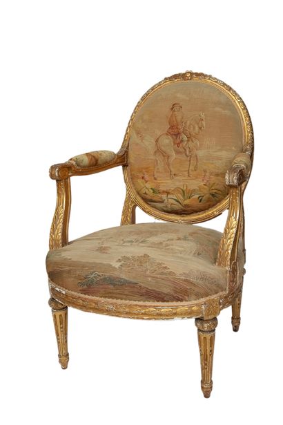  Suite of four armchairs with medallion backs, rich stuccoed decoration, fluted tapered...