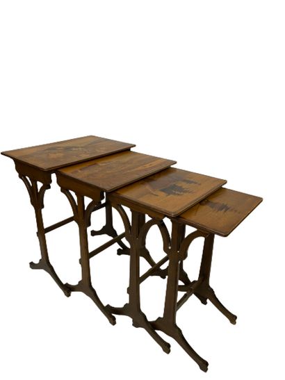  Gallé Emile Series of four rectangular nesting tables in carved wood with stylized...