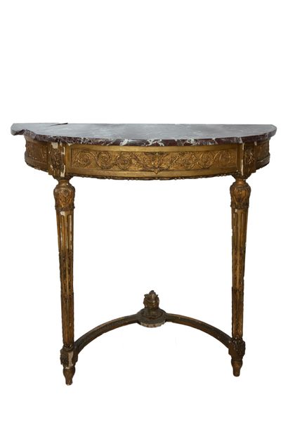  A half-moon shaped console in stuccoed and gilded wood, the belt with foliage motifs,...