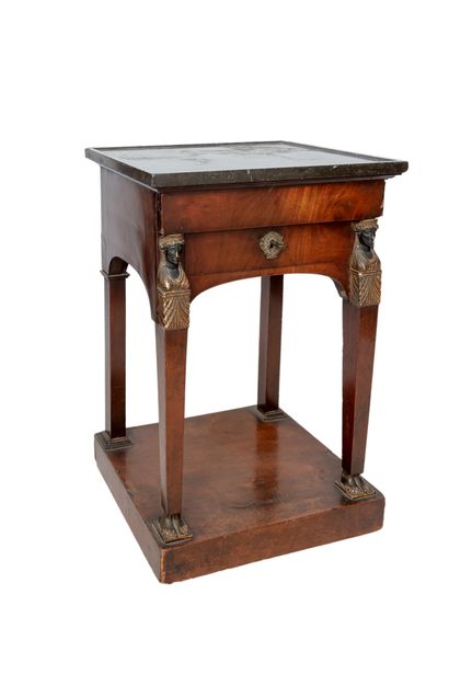  Small mahogany and mahogany veneer bedside table in the Empire style opening with...