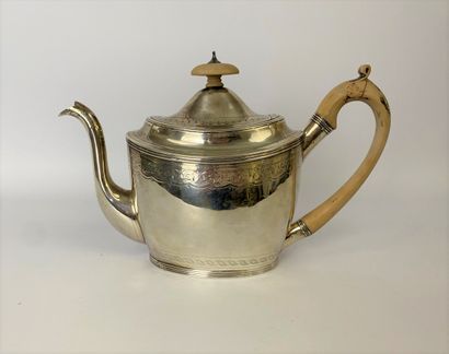 Oval silver teapot with engraved decoration...