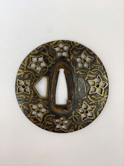  An openwork iron tsuba with gold embellishment Japan In the Heianjo style, the decoration...
