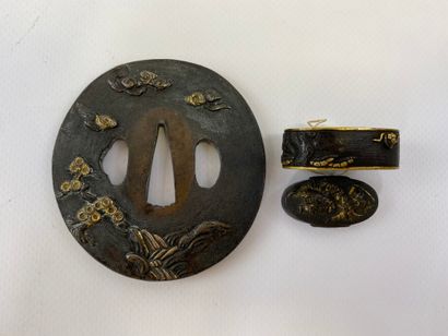  Iron tsuba with gold and fuchi kashira Japan Maru-gata decorated with a warrior...