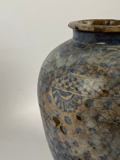  A large blue and ochre Persian enamelled terracotta vase, with geometric and floral...