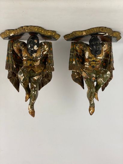 Pair of small wood and polychrome and gilded...