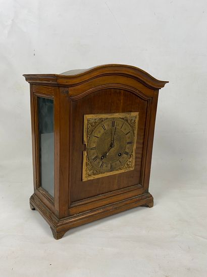 A veneer clock with moulded pediment, brass...