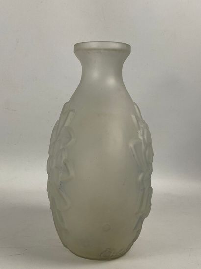  BELGIUM. Vase with flat body and flared neck in moulded glass with floral decoration...