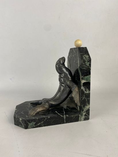 A marble and silver plated metal bookend...