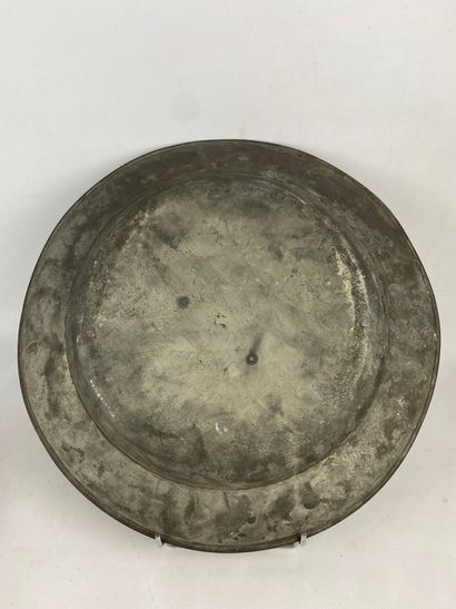  Large circular pewter dish with engraved and chased decoration of an allegory of...