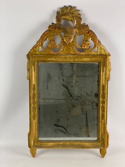 Wooden and gilded stucco pediment mirror...