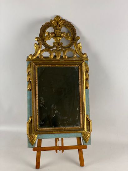 Small molded wood mirror with gilded stucco...