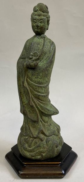 CHINA 
Bronze subject representing a deity...