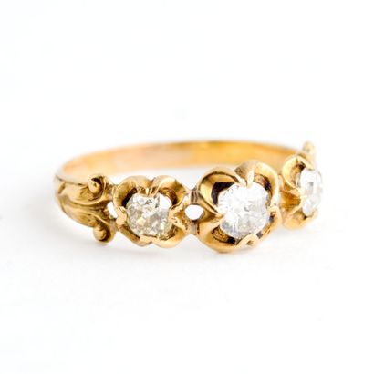  Yellow gold ring (585) with openwork setting adorned with three old cut diamonds...