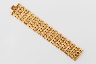 Hollow yellow gold (750) ribbon bracelet with five rows of articulated ogival links...