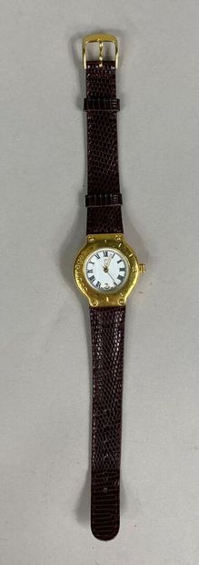  COURREGES 
Ladies' wristwatch, gilded metal case, graduated and engraved bezel 
Quartz...