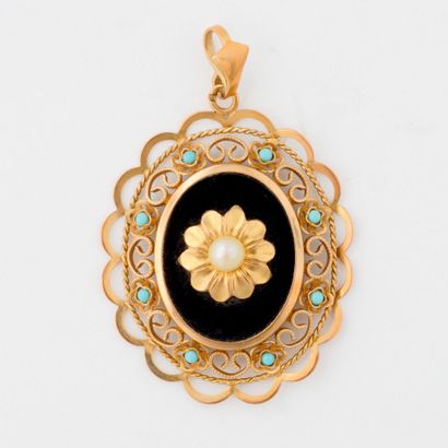  Yellow gold (750) and onyx medallion pendant centered on a flower motif adorned...