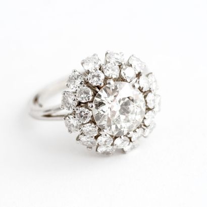  Platinum (850) Flower ring set with an old-cut diamond in a tiered setting of brilliant-cut...