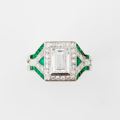  Platinum (850) ring set with an emerald-cut diamond in a closed setting, surrounded...