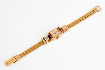  ROLEX 
Montre bracelet de dame en or jaune (750) et platine (850) 
Boîtier rectangulaire...