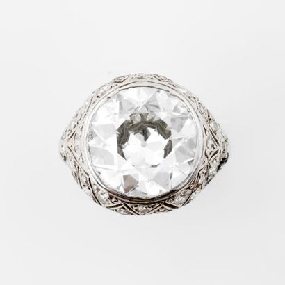  Platinum (850) ring set with an old-cut diamond in a closed setting, openworked...