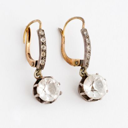  Pair of yellow gold (750) and silver (925) sleepers set with faceted white stones...