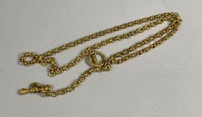  BALENCIAGA 
Long necklace in gilded metal with round links, stick clasp decorated...