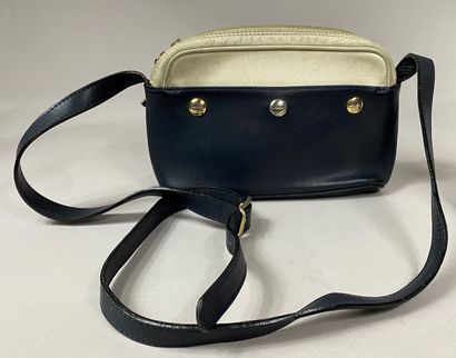  LANCEL 
Lot including a shoulder bag in navy and beige leather and a fabric bag...