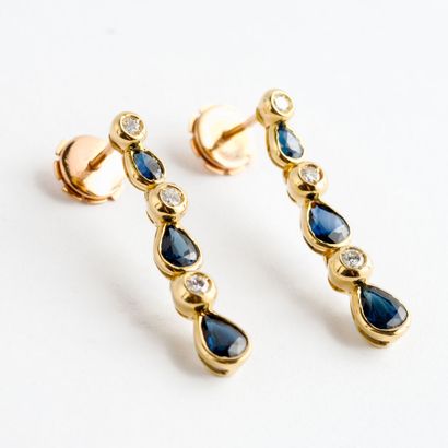  Pair of yellow gold (750) earrings set with a fall of brilliant-cut diamonds alternated...