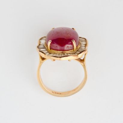  Half-set comprising a yellow gold (585) skirt ring set with an oval cabochon of...