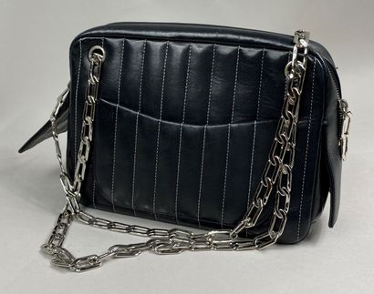  CHANEL 
Mademoiselle camera bag in black lambskin, white stitching, two silver metal...