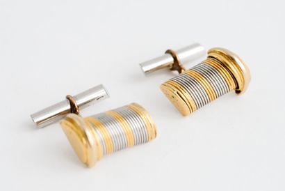  CARTIER 
Pair of yellow gold (750) and steel cufflinks with grooved decoration 
Signed...