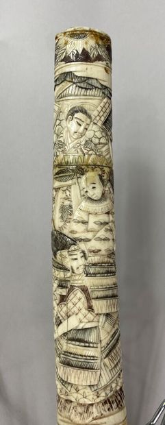  JAPAN - 20th century 
Wakizashi type sword. Bone frame carved with wise men, children,...