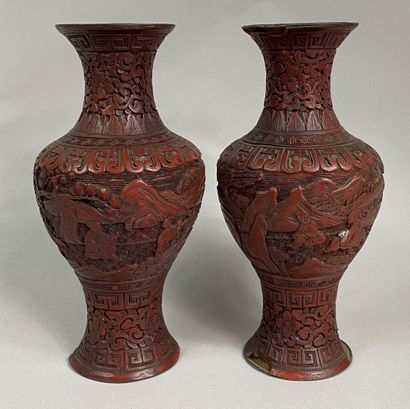  CHINA, End of XIX-XXth century 
Set of two baluster vases in cinnabar lacquer decorated...