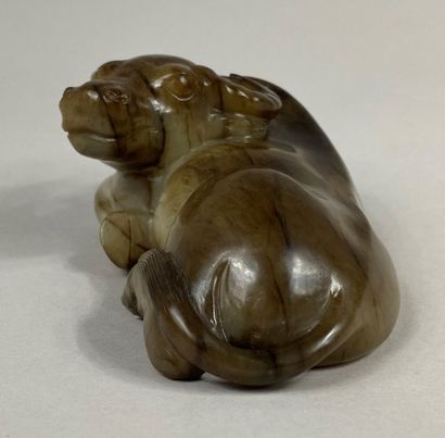  CHINA, late Qing dynasty, Ming style 
Nephrite jade water buffalo carved in beige...