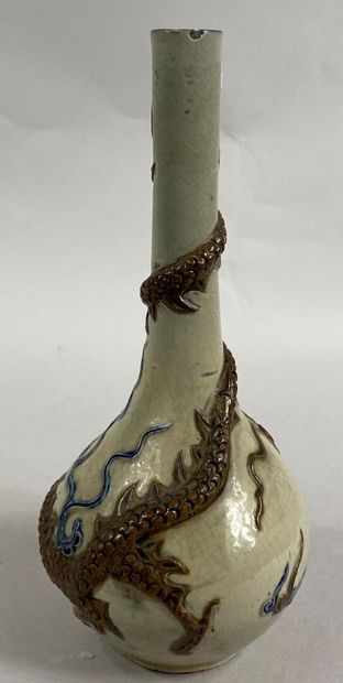  VIETNAM 
Enameled stoneware bottle vase on a cream background decorated with a dragon...