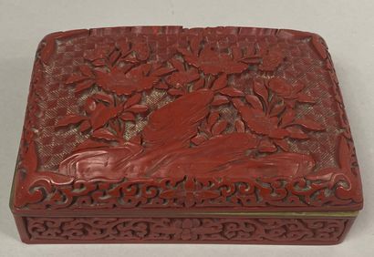 CHINA, 20th century 
Rectangular box in cinnabar lacquer decorated with flowers...