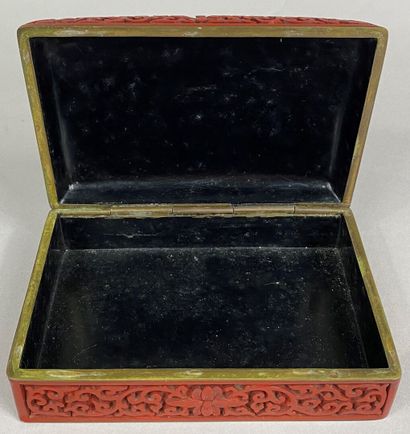  CHINA, 20th century 
Rectangular box in cinnabar lacquer decorated with flowers...