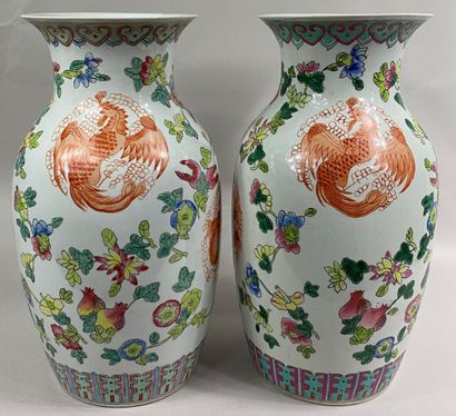  CHINA, 20th century 
Pair of enameled porcelain baluster vases in the Famille Rose...