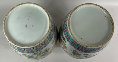  CHINA, 20th century 
Pair of enameled porcelain baluster vases in the Famille Rose...