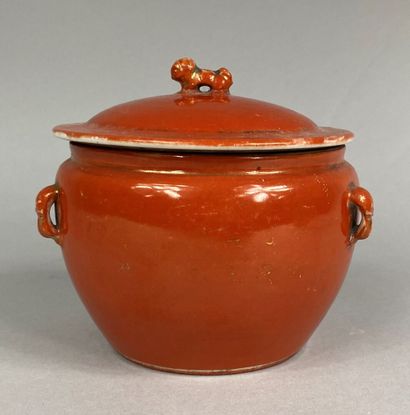  CHINA 
Small covered pot in coral colored ceramic. The frétel in the shape of a...