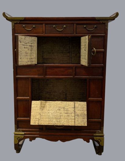  CHINA 
Small wooden apothecary cabinet with three drawers and two leaves. The pediment...