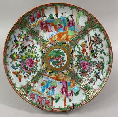  CHINA, CANTON 
Polychrome porcelain plate decorated with foliage and palace scenes....
