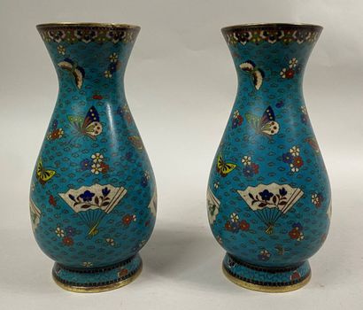  CHINA 
A pair of cloisonné vases decorated with butterflies, flowers and fans on...