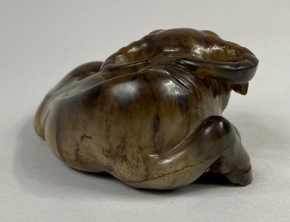  CHINA, late Qing dynasty, Ming style 
Nephrite jade water buffalo carved in beige...