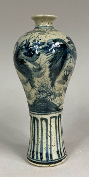  VIETNAM, 20th century 
A blue-white porcelain miniature vase decorated with a lake...