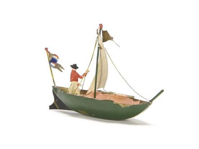 null ISSMAYER : Petit bateau à voile avec son marin, présenté en diorama.
 9 x 6...